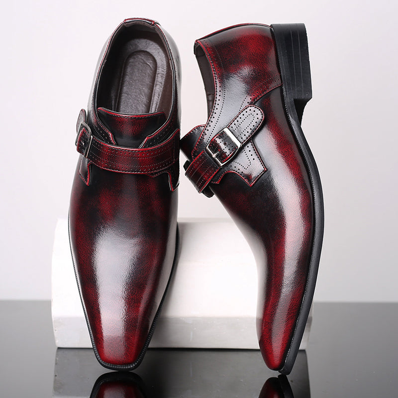 Black lacquered monk strap dress shoes with high-gloss finish and single-buckle detail