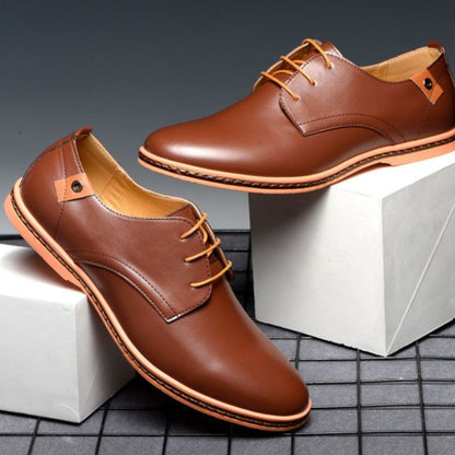 Black synthetic leather Derby shoes with clean lines and subtle contrast detailing for smart-casual style