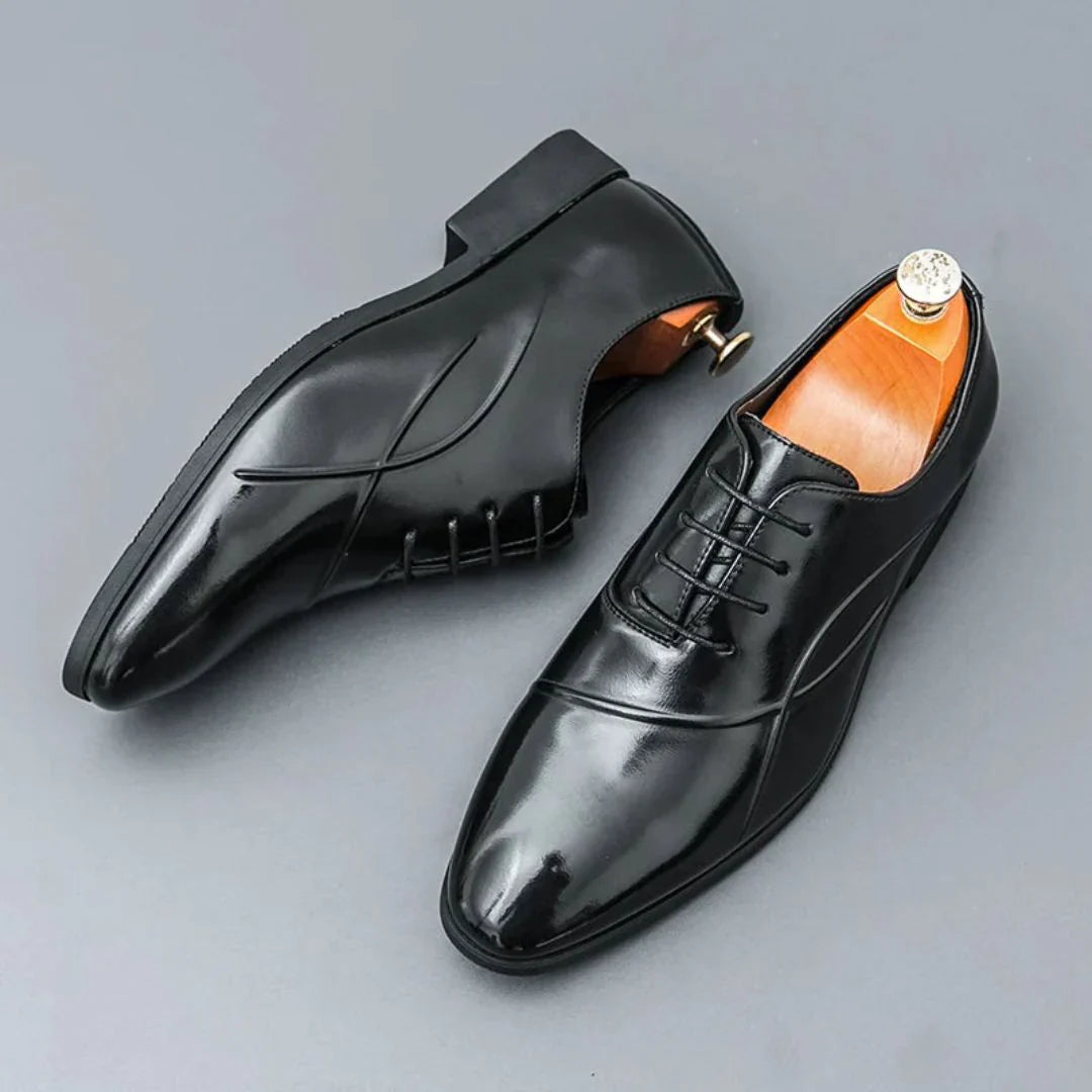 Men's two-tone leather Oxford dress shoes with pointed toe, sleek silhouette, and durable rubber sole