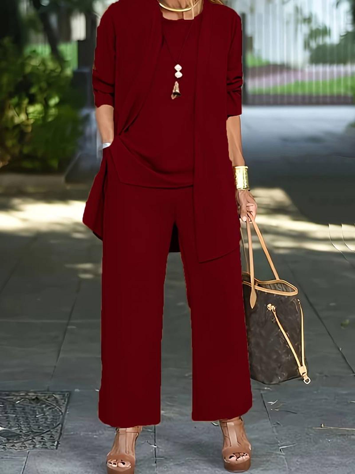 Women's three-piece relaxed outfit set with wide-leg pants, flowing top, and lightweight outer layer