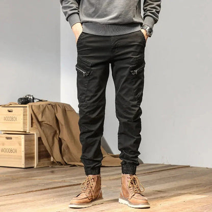 Men's olive green utility cargo jogger pants with multi-pocket design and adjustable quick-dry fit