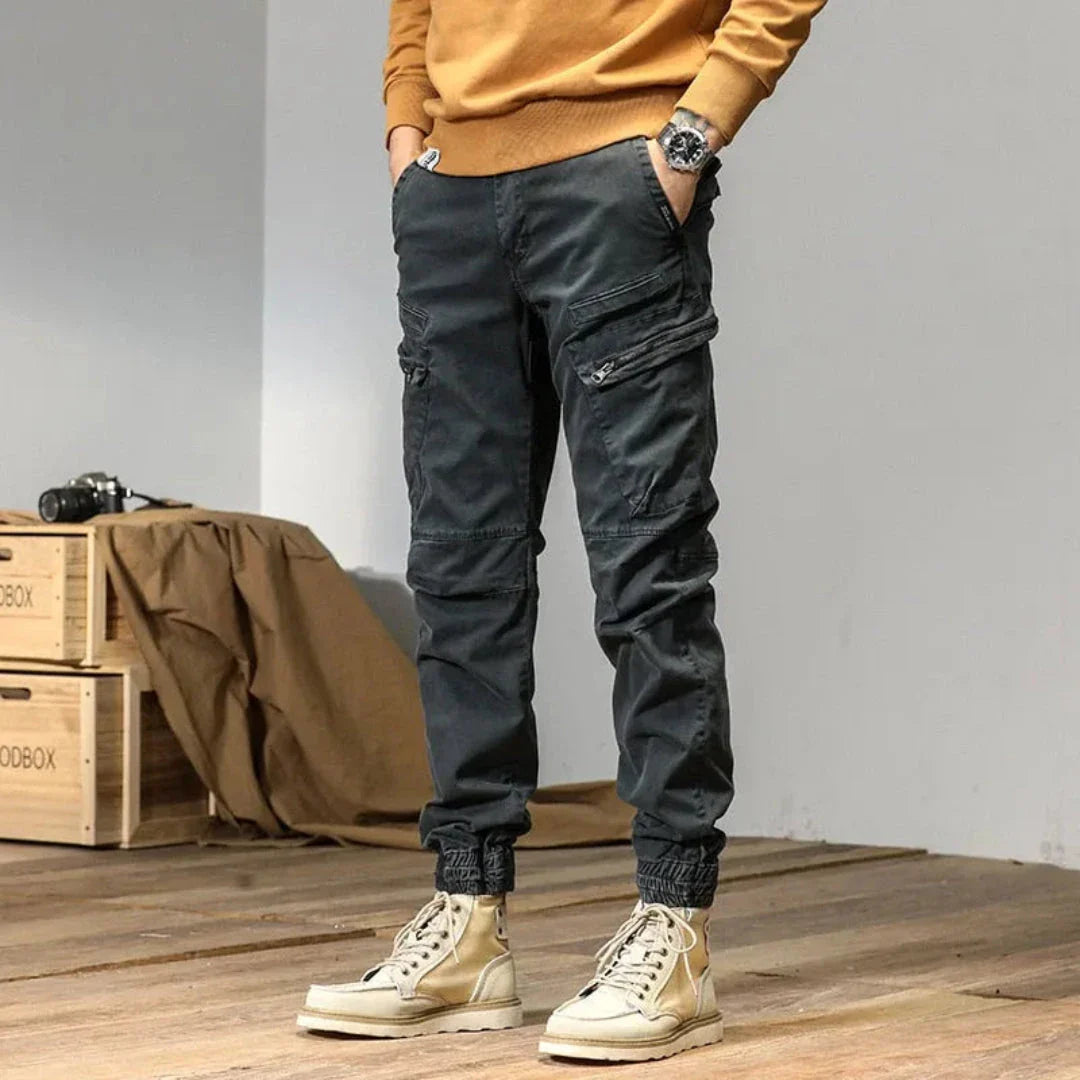 Men's olive utility cargo jogger pants with multi-pocket design and adjustable quick-dry fit