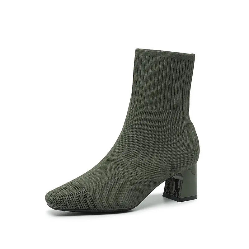 Women's black knit sock ankle boots with 2.5-inch heel, stretchy fabric and sleek contemporary silhouette