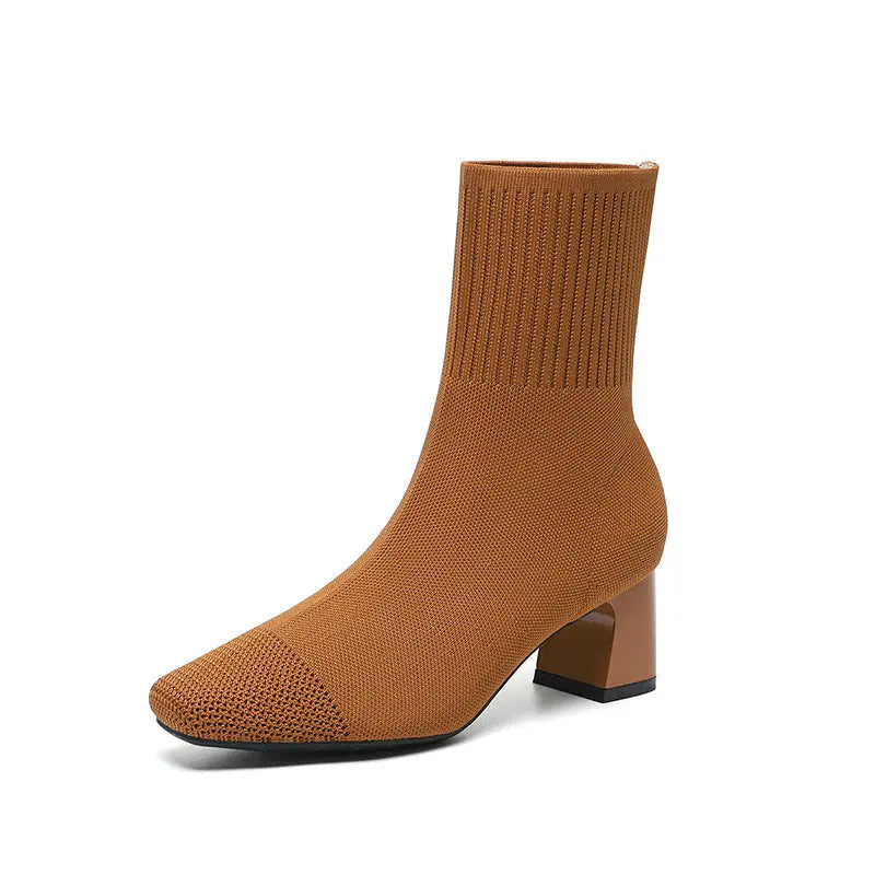 Women's black knit sock ankle boots with 2.5-inch heel, stretchy fabric and sleek contemporary silhouette