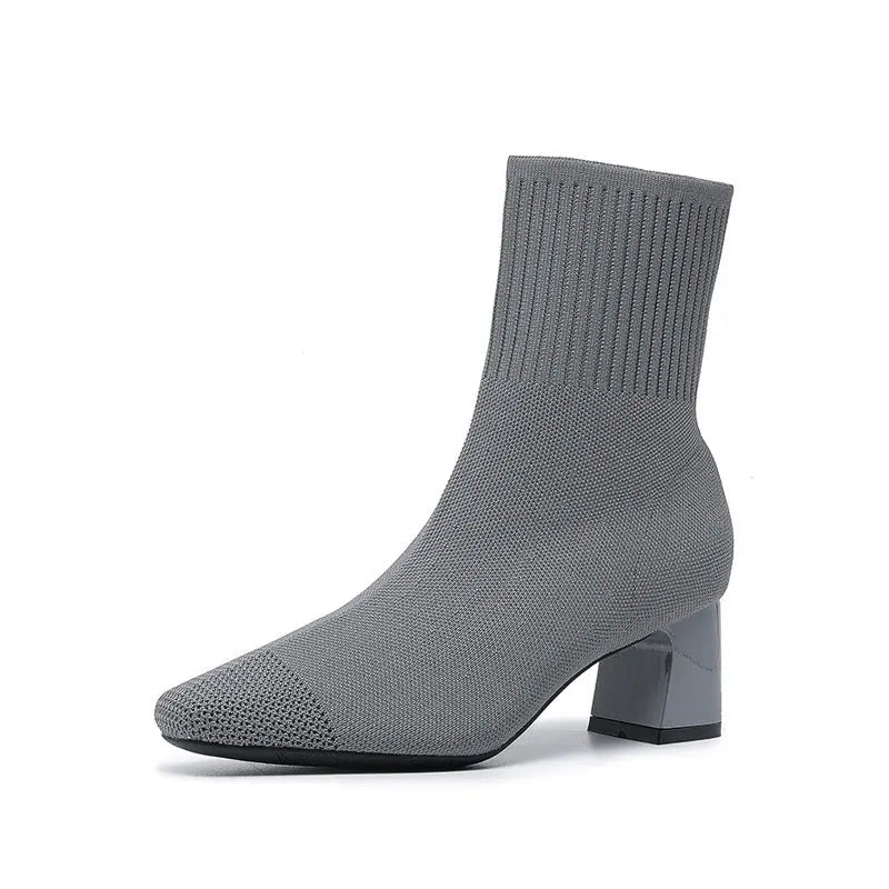 Women's black knit sock ankle boots with 2.5-inch heel, stretchy fabric and sleek contemporary silhouette