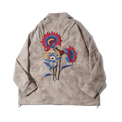 Beige floral embroidered shirt jacket with button closure, drawstring hem, and retro long-sleeve design