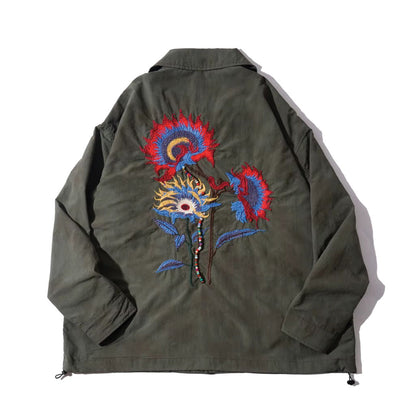 Beige floral embroidered shirt jacket with drawstring hem, long sleeves, and vintage-inspired button closure