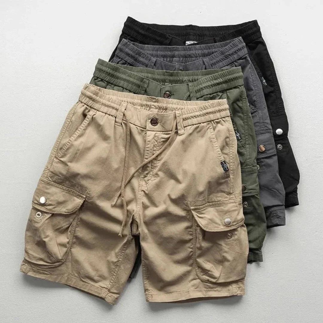 Men's khaki relaxed-fit cargo shorts with elastic waist, multi-pocket design for hiking and travel