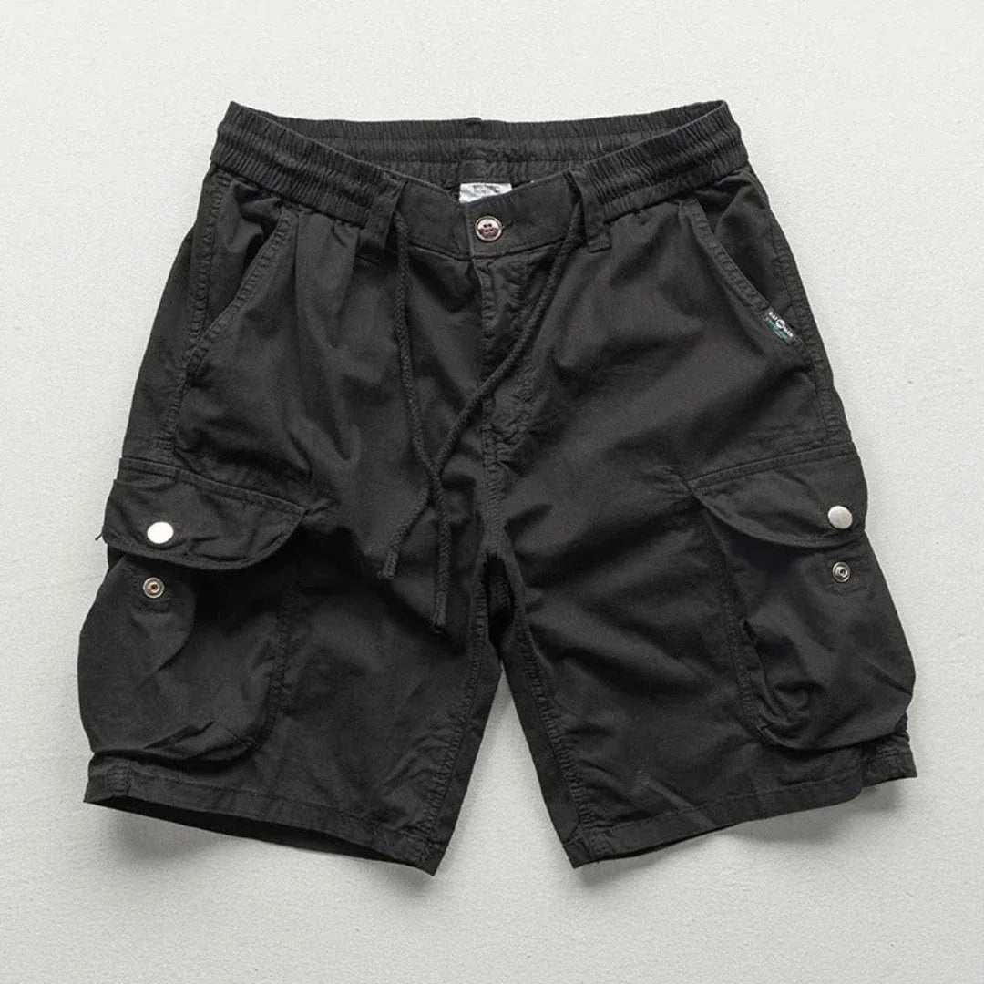 Men's khaki relaxed-fit cargo shorts with elastic waist, multi-pocket design for hiking and travel