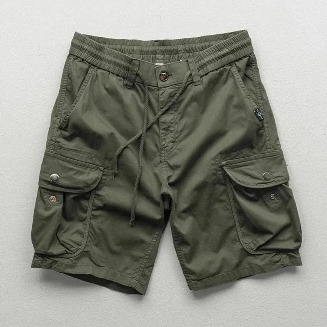 Men's khaki relaxed-fit cargo shorts with elastic waist and multi-pocket hiking design