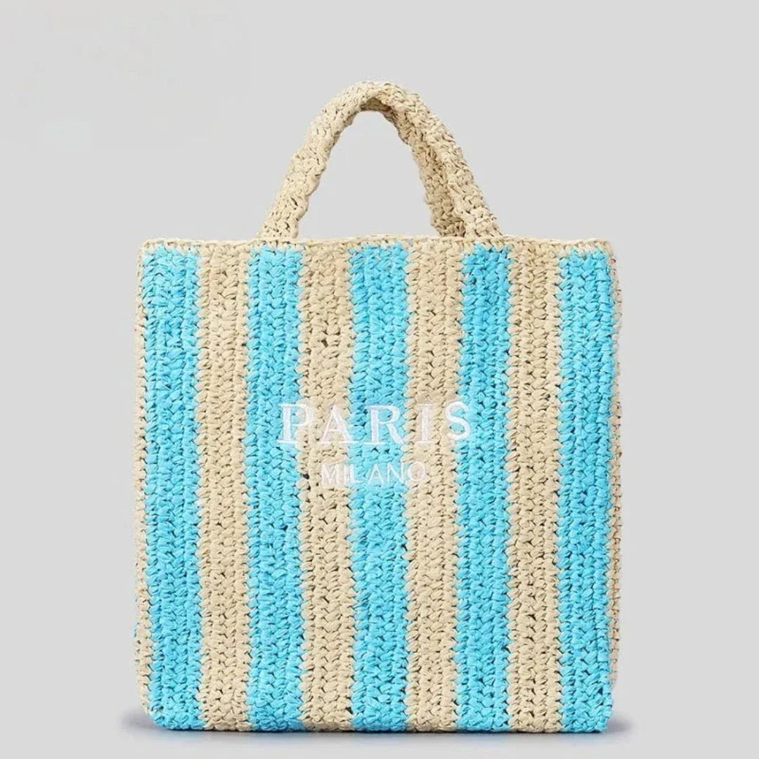 Handcrafted woven straw tote bag with bold vibrant orange stripes, lightweight beach and market carry-all