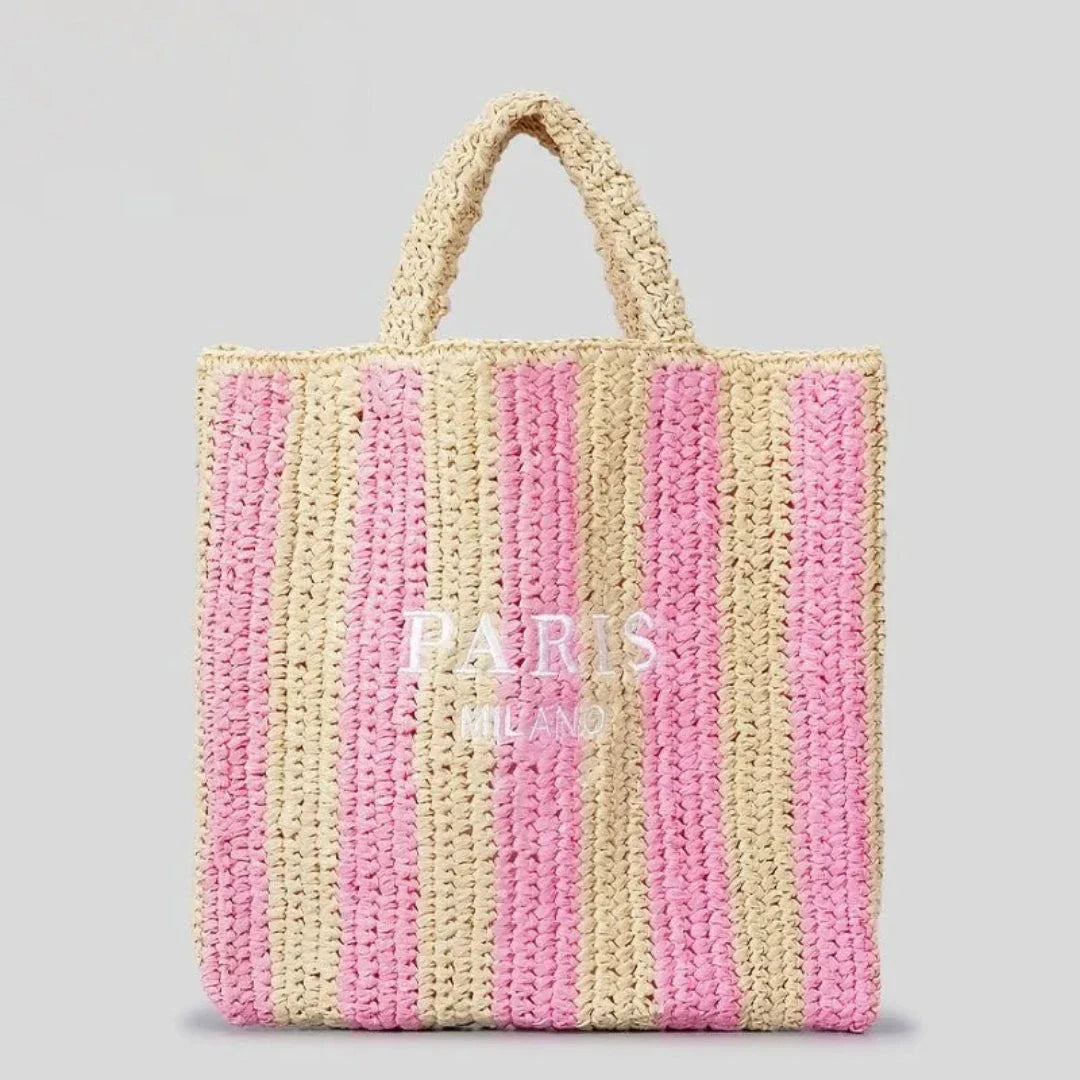 Handcrafted woven straw tote bag with bold vibrant orange stripes, lightweight beach and market carry-all