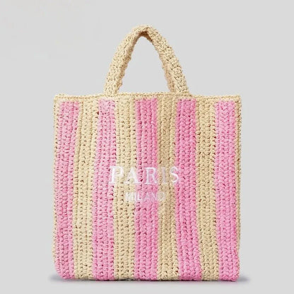 Handcrafted woven straw tote bag with bold vibrant orange stripes, lightweight beach and market carry-all