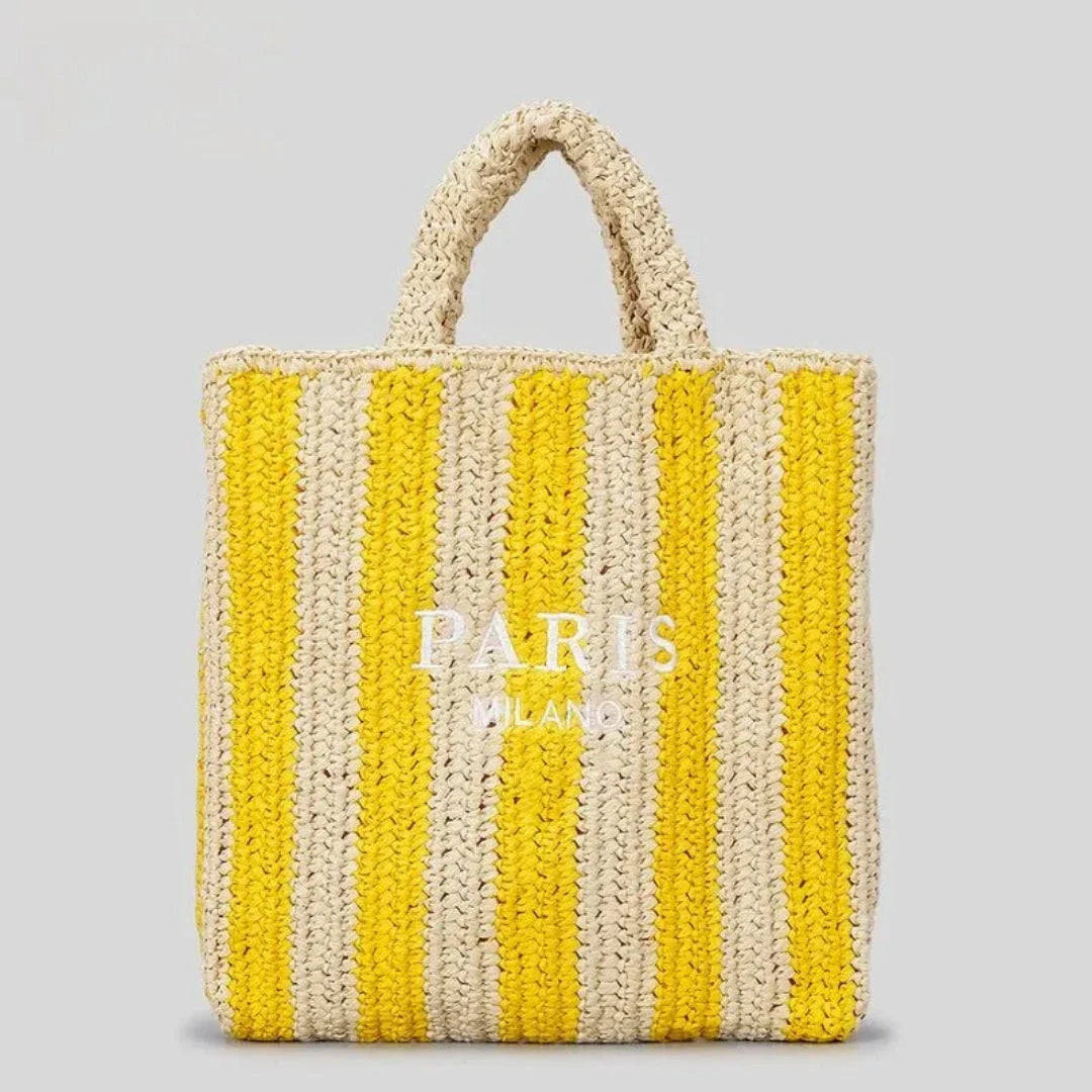 Handcrafted woven straw tote bag with bold vibrant orange stripes, lightweight beach and market carry-all