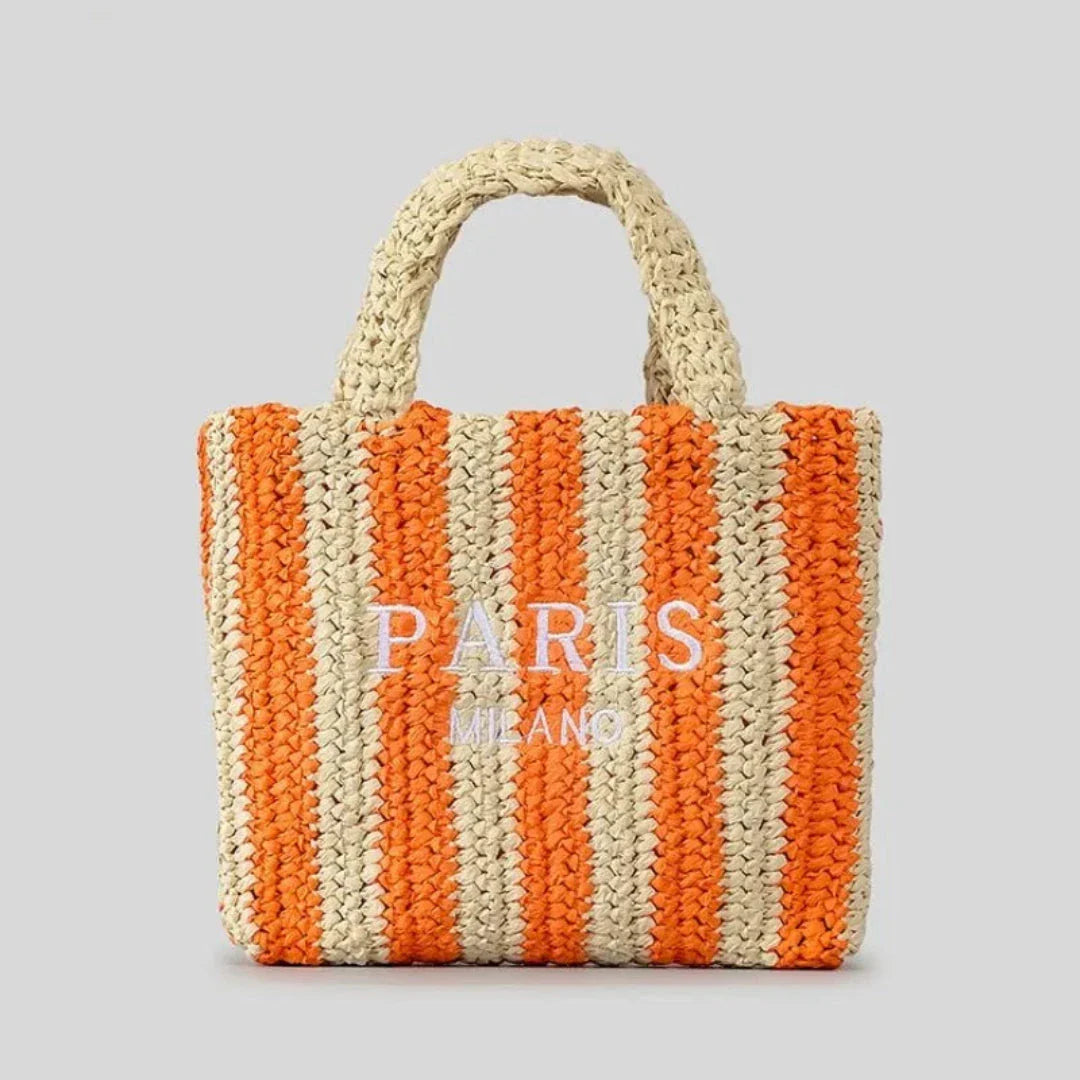 Handcrafted woven straw tote bag with vibrant orange stripes, lightweight beach and market carry-all