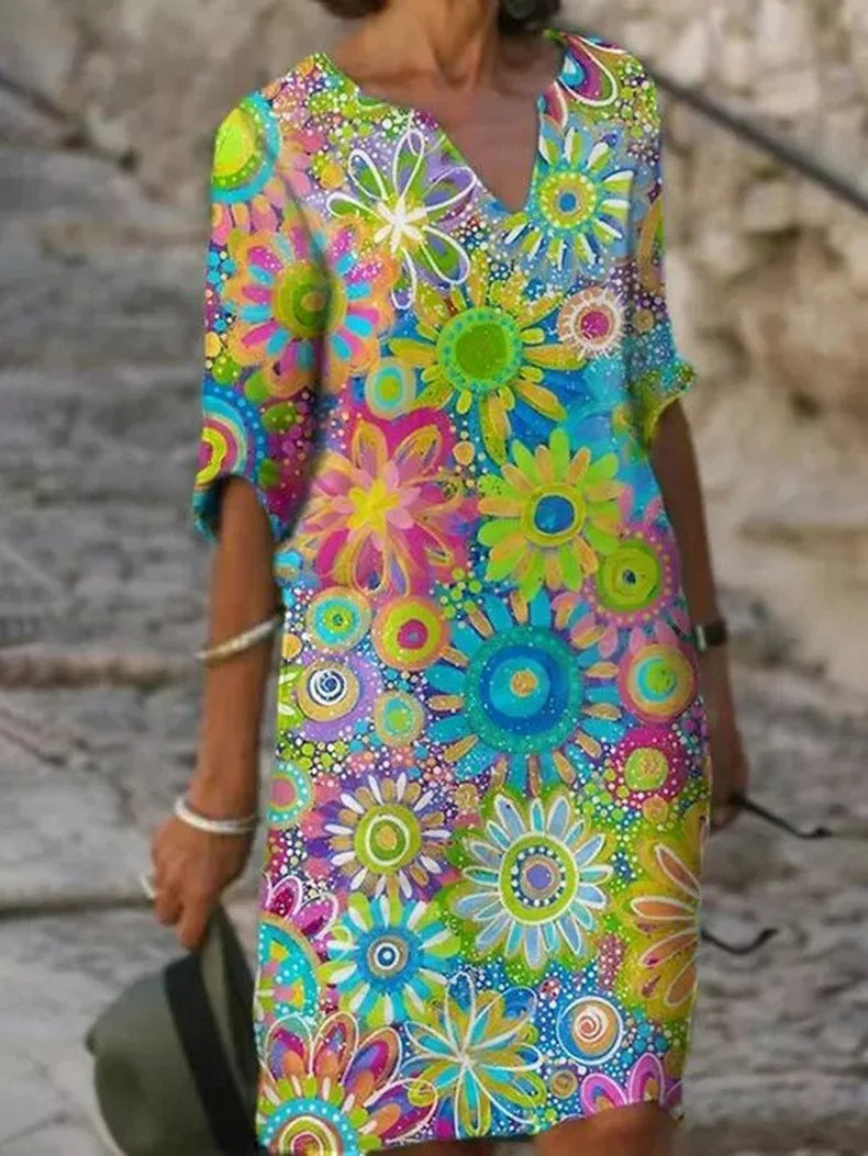 Women's floral flowy elegant dress with flattering feminine fit and flowing skirt silhouette