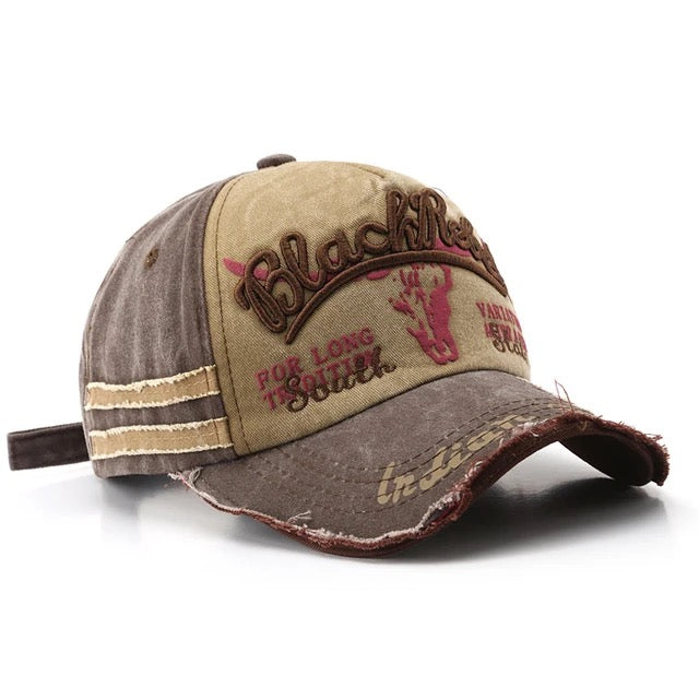 Black distressed cotton trucker hat with embroidered "Rebel" lettering and adjustable snapback closure