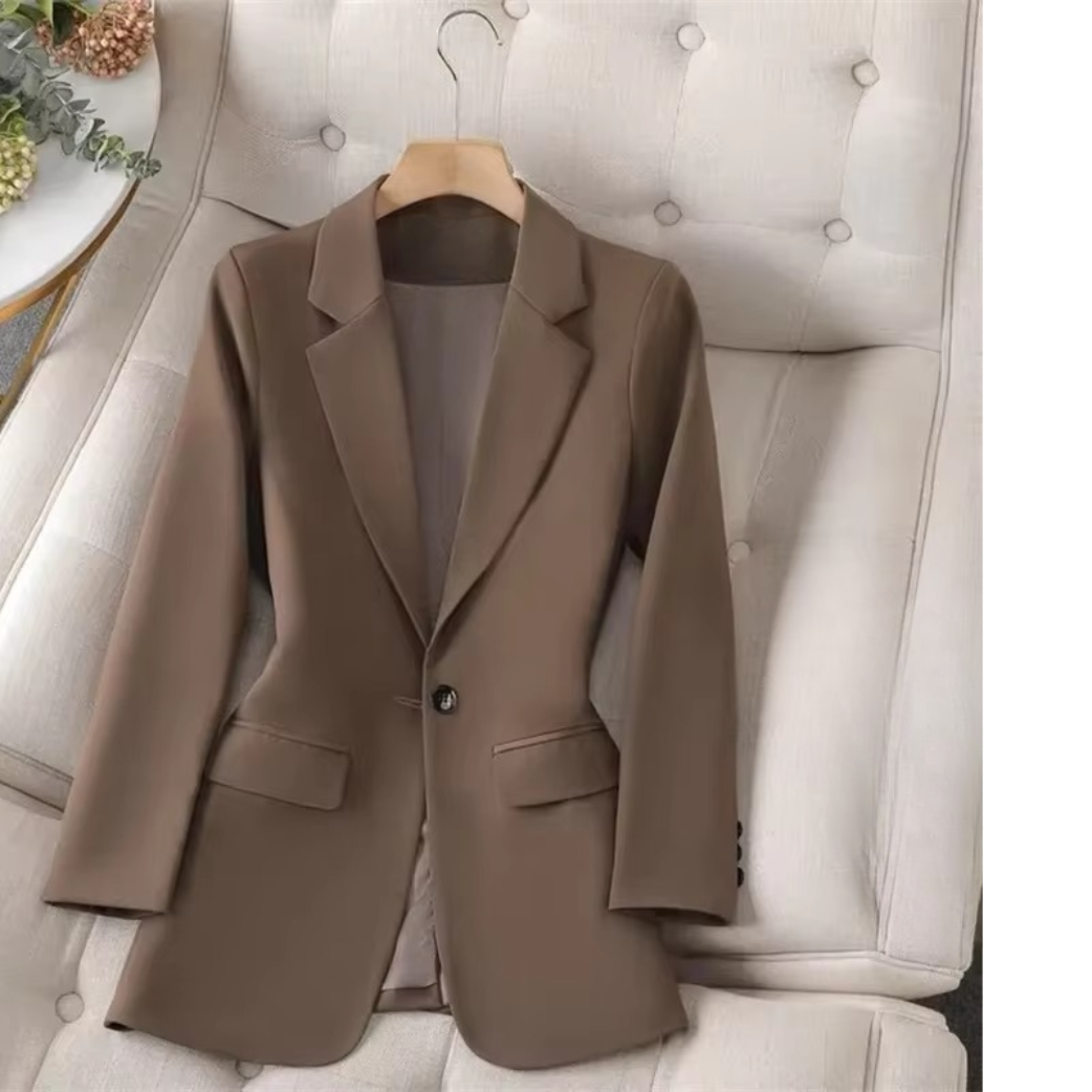 Women's green single-button blazer with sleek streamlined silhouette for a polished professional look