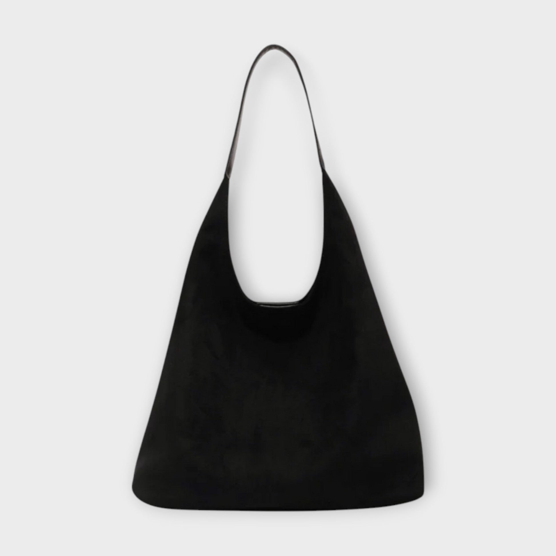 Minimalist beige shoulder bag with soft structured silhouette and simple single strap for everyday elegance