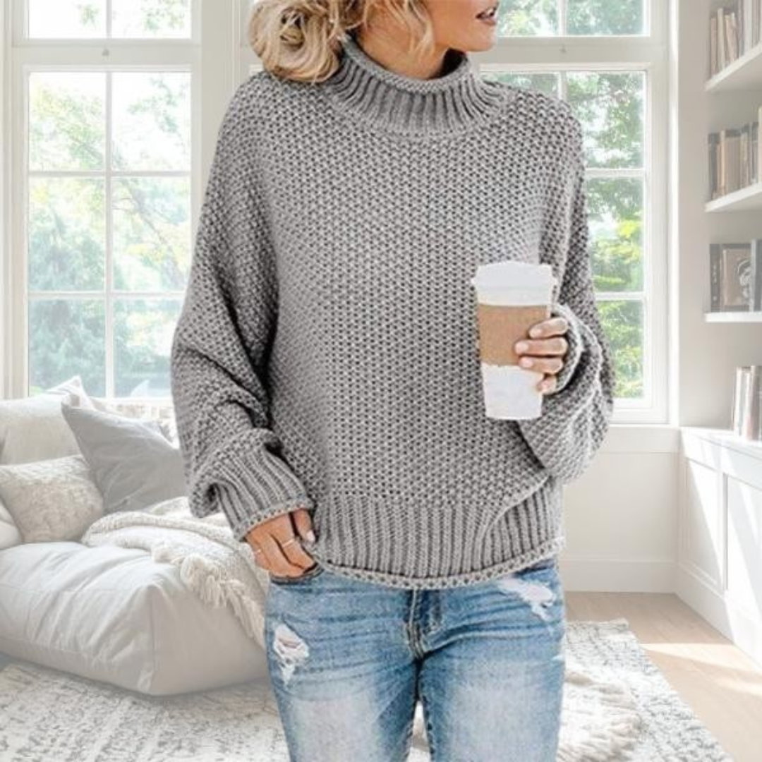Beige soft knit relaxed pullover with graceful drape and understated elegant silhouette