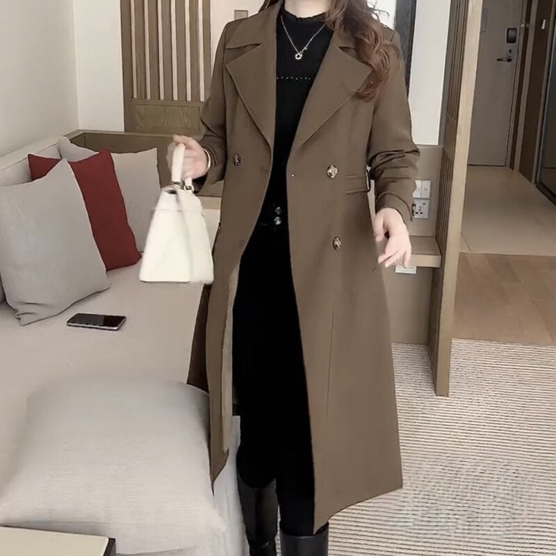 Beige sophisticated trench coat with adjustable waist-defining belt and streamlined silhouette