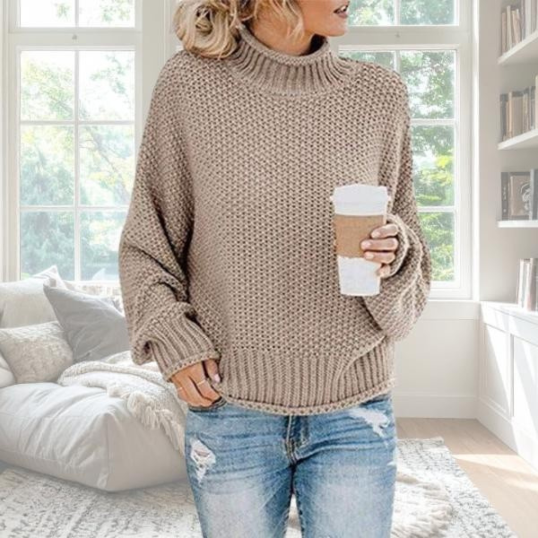 Beige soft knit relaxed pullover with graceful drape and understated elegant silhouette