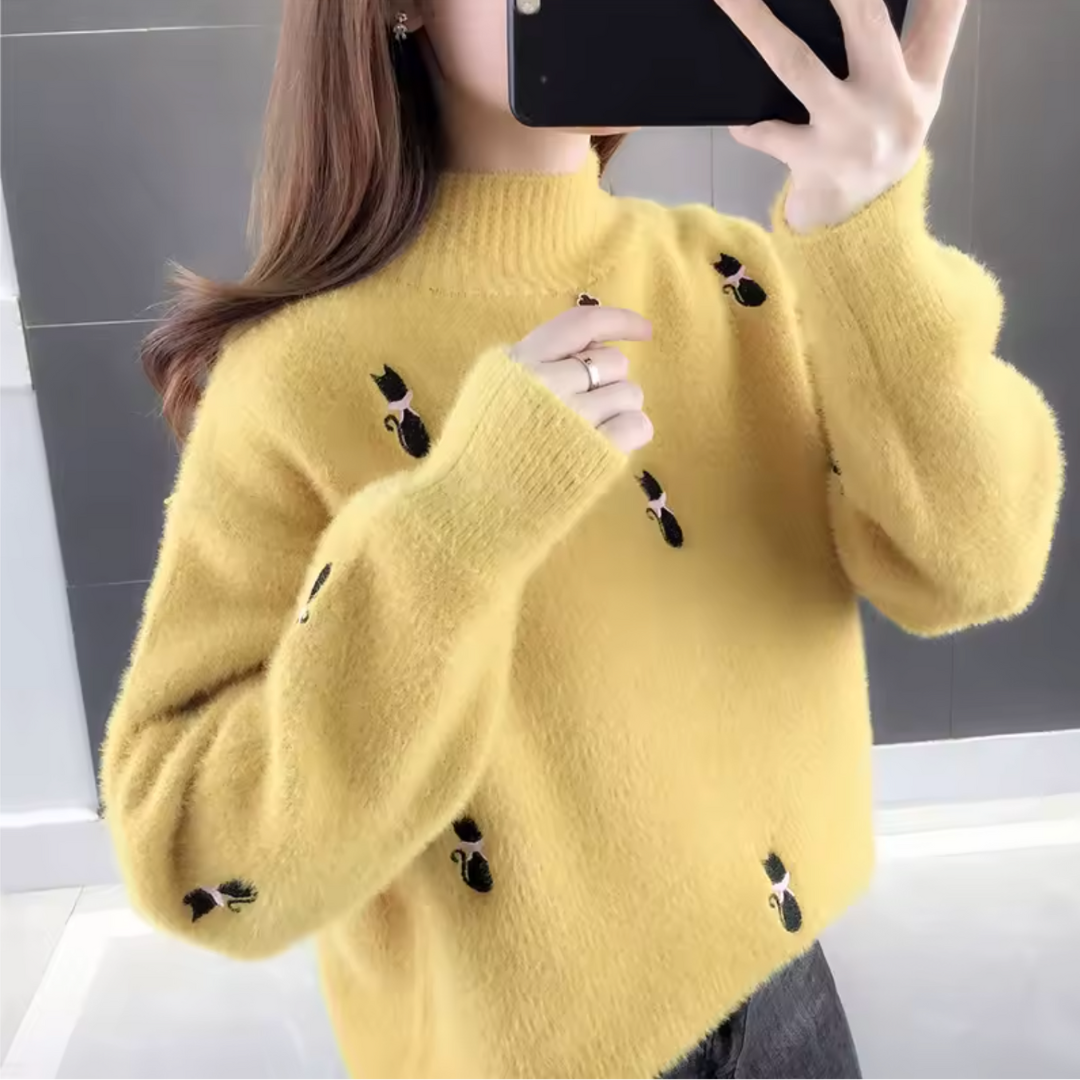 Salem mochi cashmere sweater in relaxed fit with half-high collar and embroidered detailing