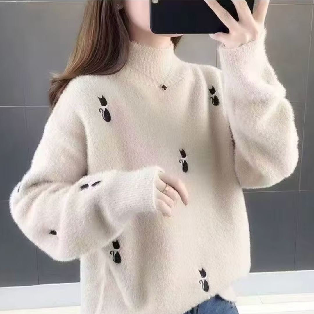 Salem mochi cashmere sweater in relaxed fit with half-high collar and embroidered detailing