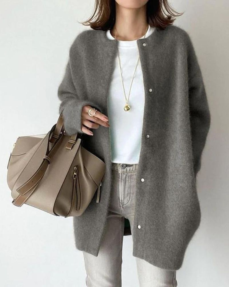 Women's oversized soft knit cardigan in neutral tone, button-front mid-length relaxed silhouette for layering