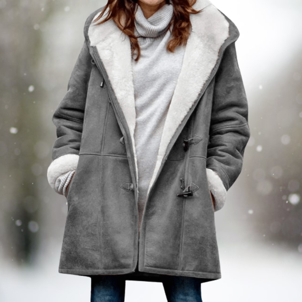 Ivory sherpa winter coat with plush texture, cozy relaxed fit, and refined silhouette for cold weather