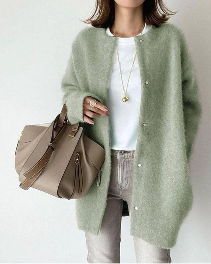 Women's oversized soft knit cardigan in neutral tones, button-front mid-length layering style