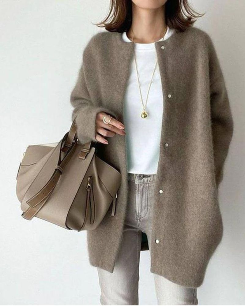 Women's oversized soft knit cardigan in neutral tones, button-front mid-length layering piece