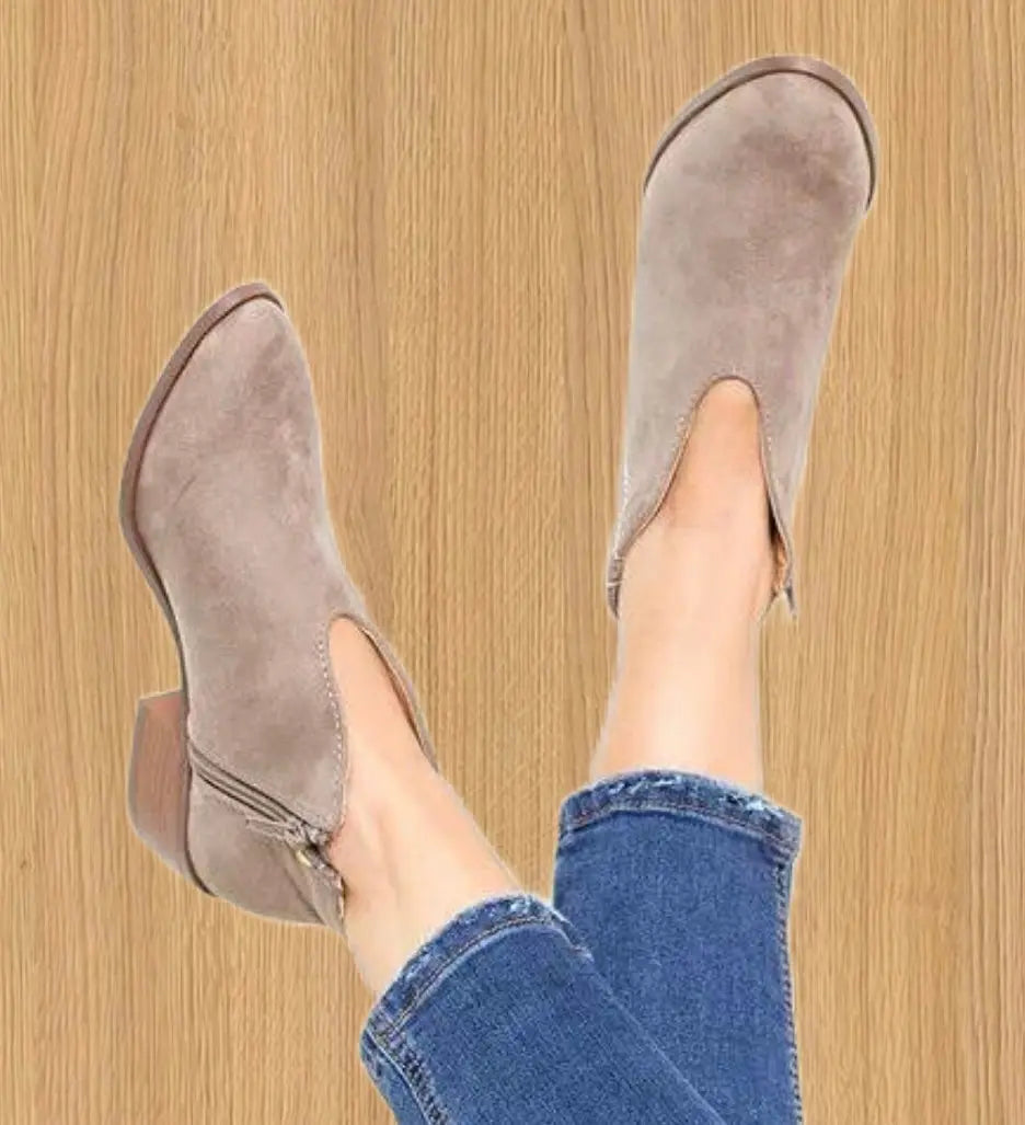 Black v-cut ankle boots for women, sleek faux leather silhouette with versatile everyday style