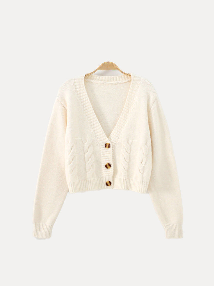 Women's cropped cable knit cardigan in cozy V-neck buttoned style, perfect fall layering essential