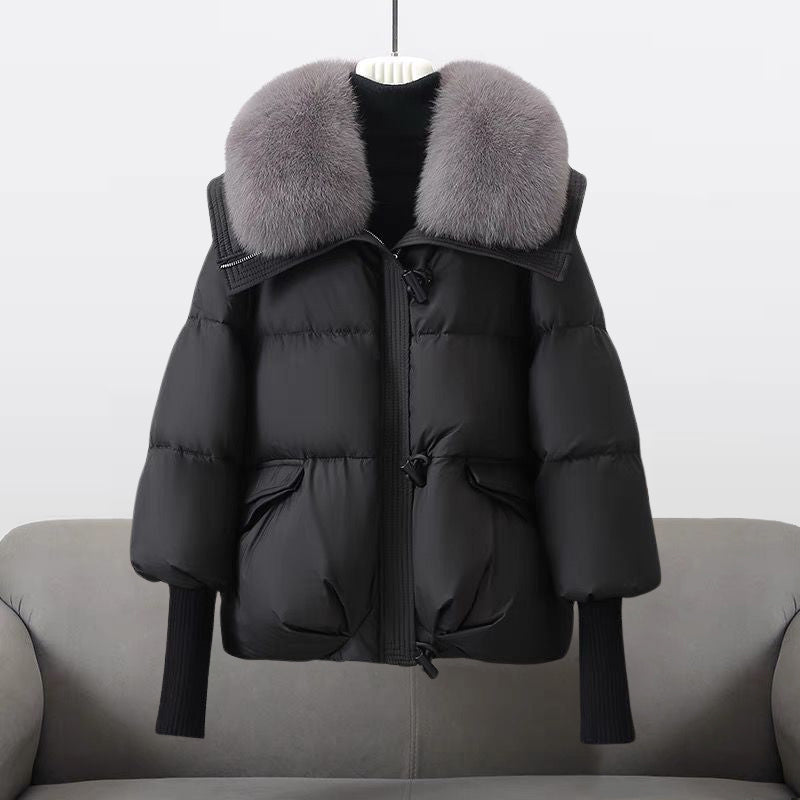 Women's oversized quilted puffer jacket with faux fur collar and toggle closure for chilly days