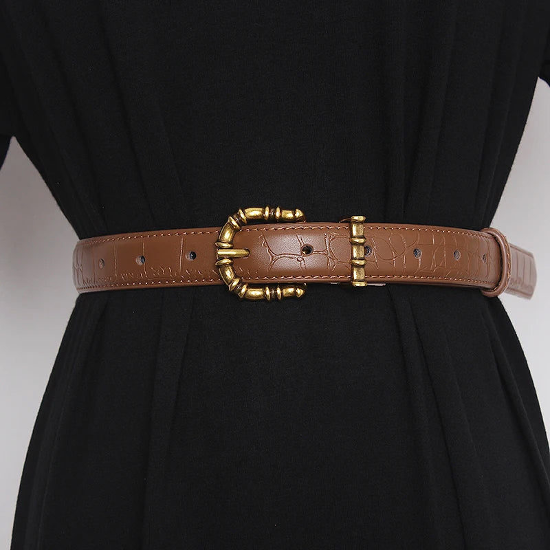 Gold-tone sculptural buckle belt in crocodile-textured leather, Baroque-inspired waist cincher