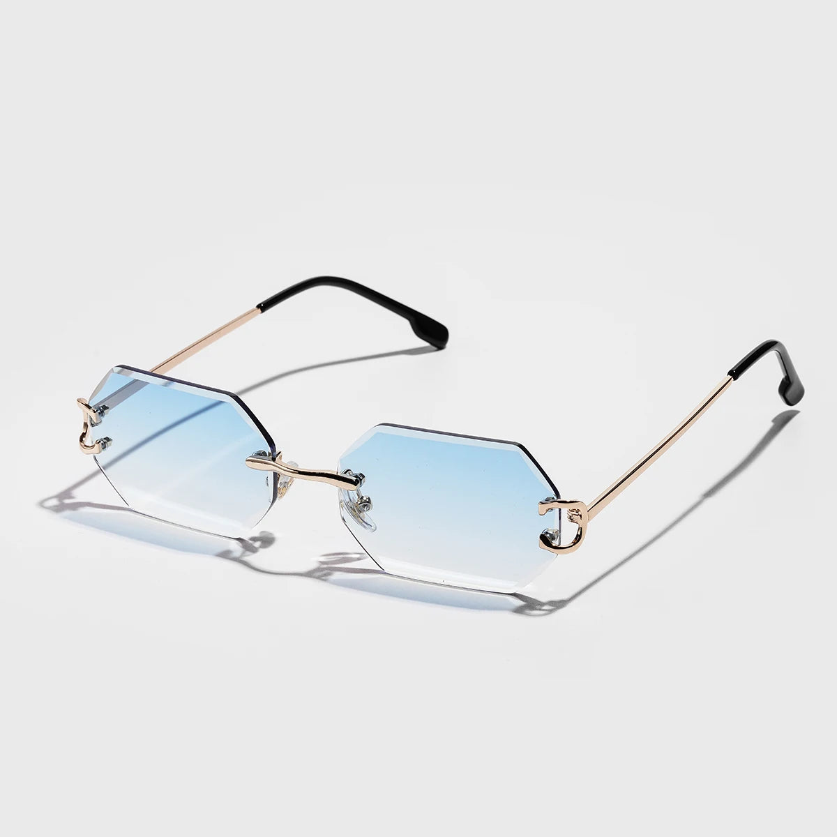 Rimless octagonal sunglasses with UV400 gradient tint and sleek silver metal temples for minimalist style