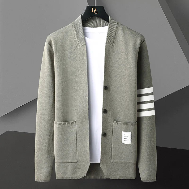 Navy blue striped cardigan with bold sleeve stripes, button-down front, and deep patch pockets