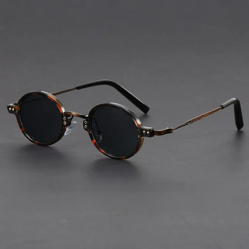Vera vintage round sunglasses with glossy acetate frame, metal arms, and UV400 retro-style lenses