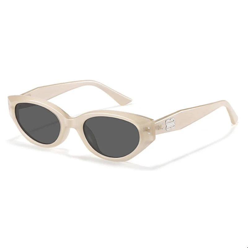 Glossy black acetate oval sunglasses with sculpted lenses, sleek temples, and metal logo detail