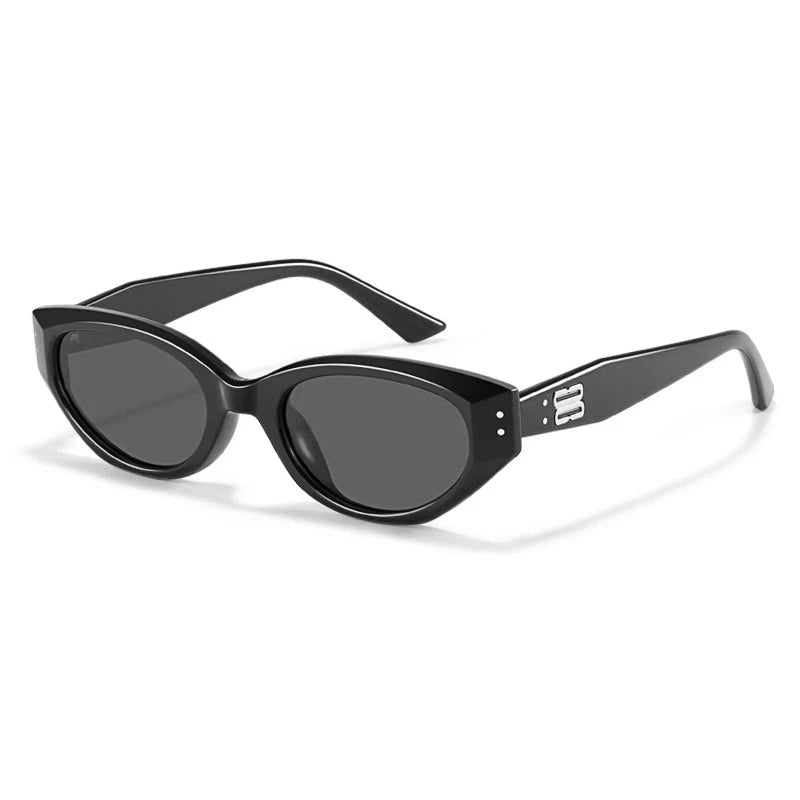 Glossy black acetate oval sunglasses with sculpted lenses, sleek temples and metal logo detail