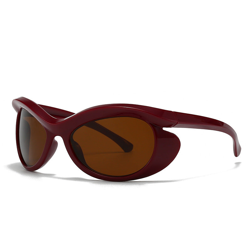 Futuristic wraparound sunglasses high-gloss black frame sculpted oval silhouette dark UV lenses
