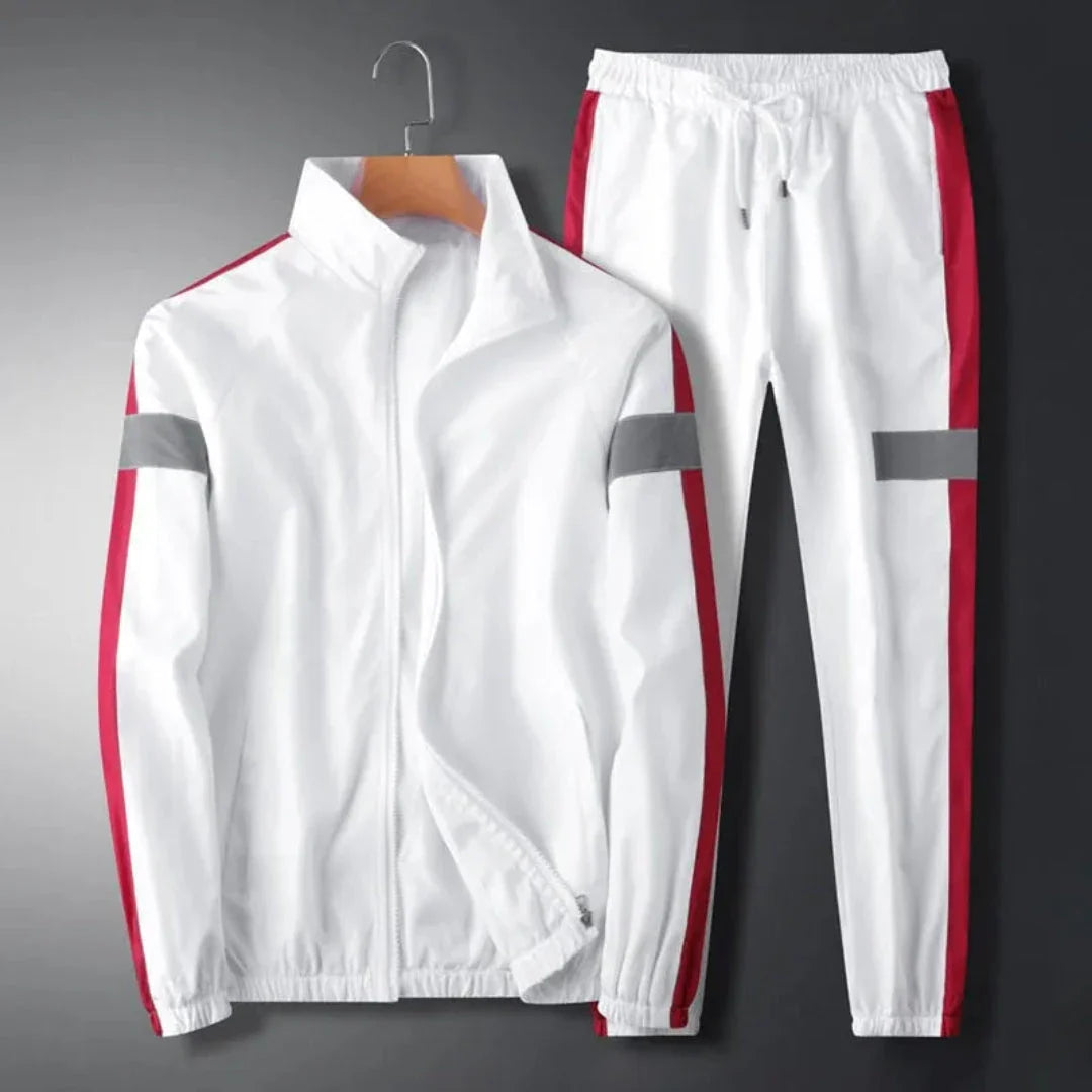Men's two-piece tracksuit with bold side panels, reflective stripes, and sporty casual athletic cut