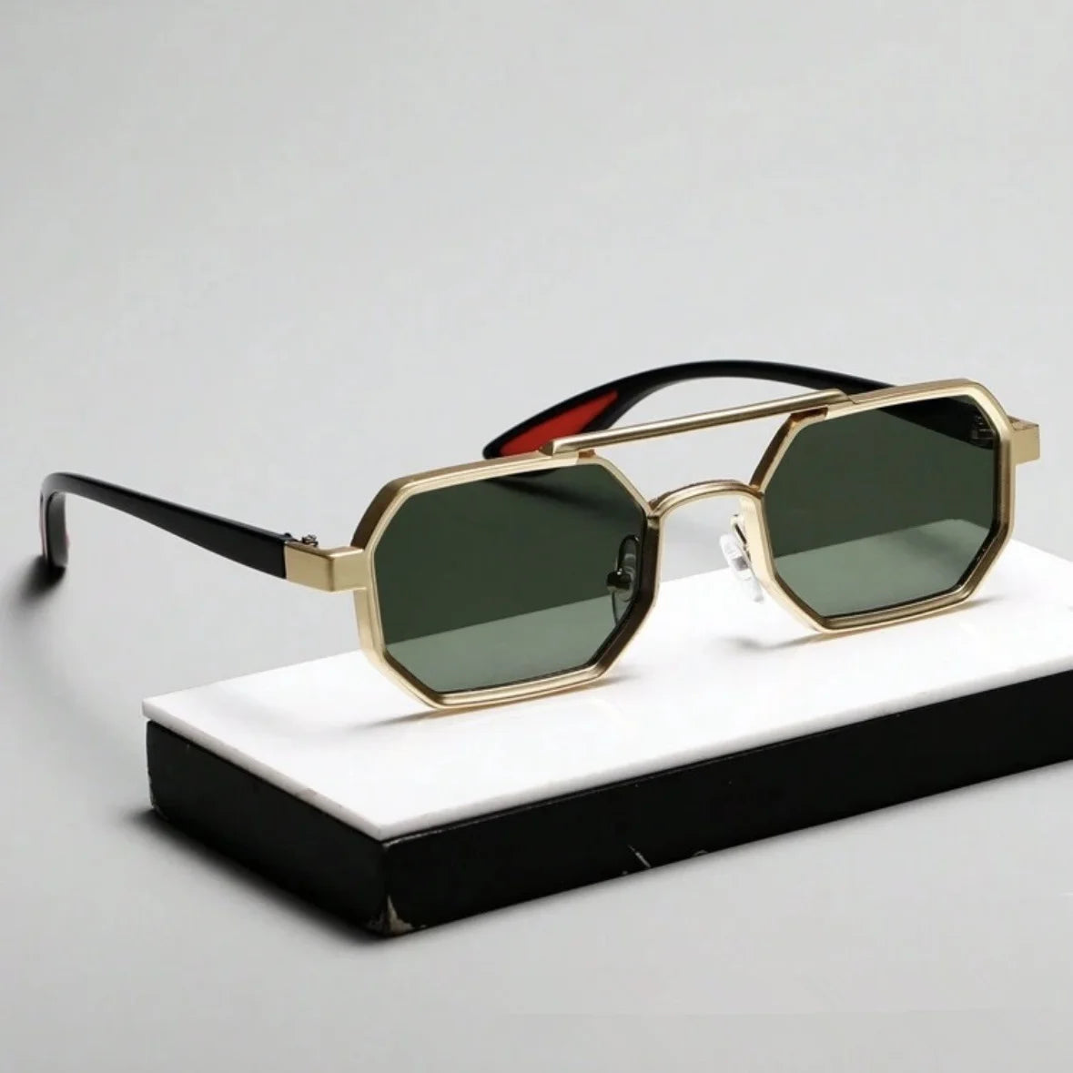 Octagonal metal frame sunglasses silver black red accents dark UV lenses retro-futurist geometric style