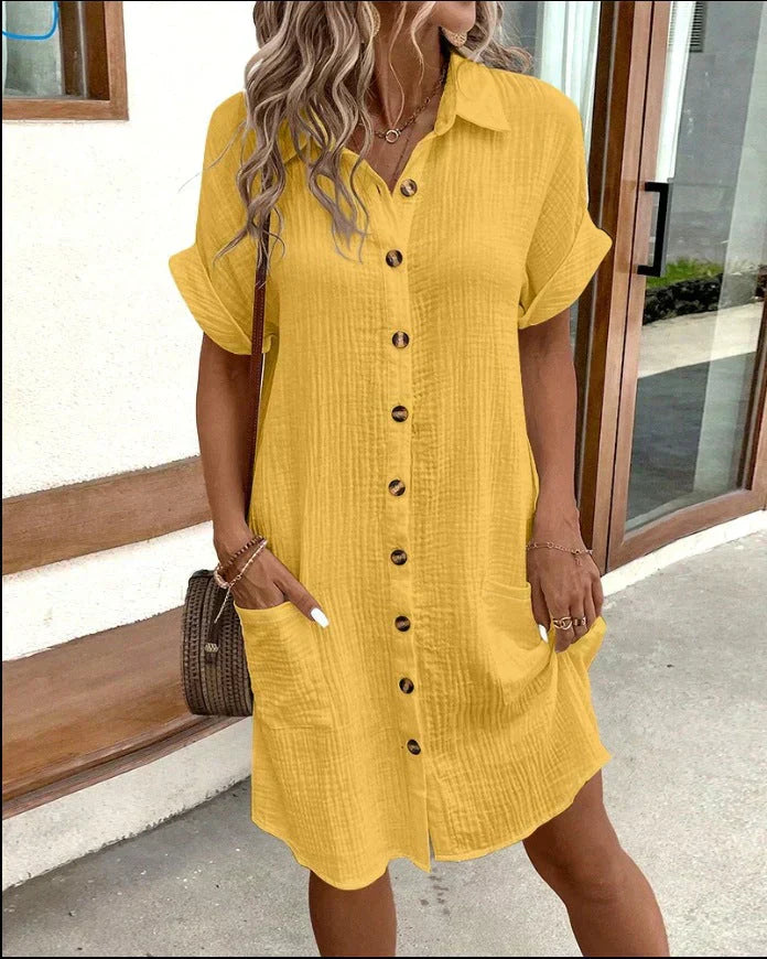 Relaxed cotton polo shirt dress in neutral tone with shirt collar and drapey warm-weather silhouette