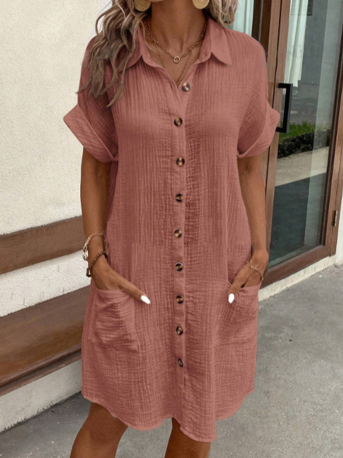 Relaxed cotton polo shirt dress in neutral tone with drapey silhouette and classic collar detail
