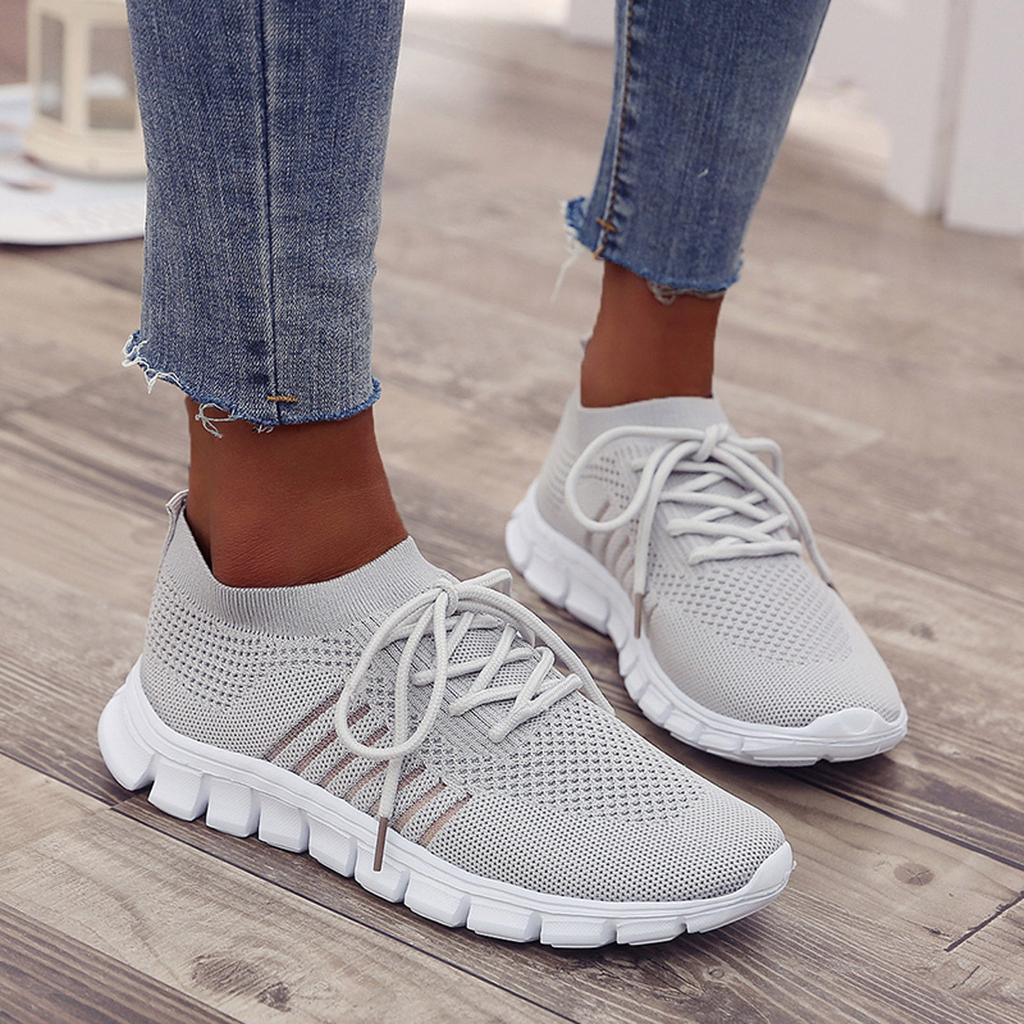 Women's breathable knit slip-on sneakers with integrated lace system and shock-absorbing sole