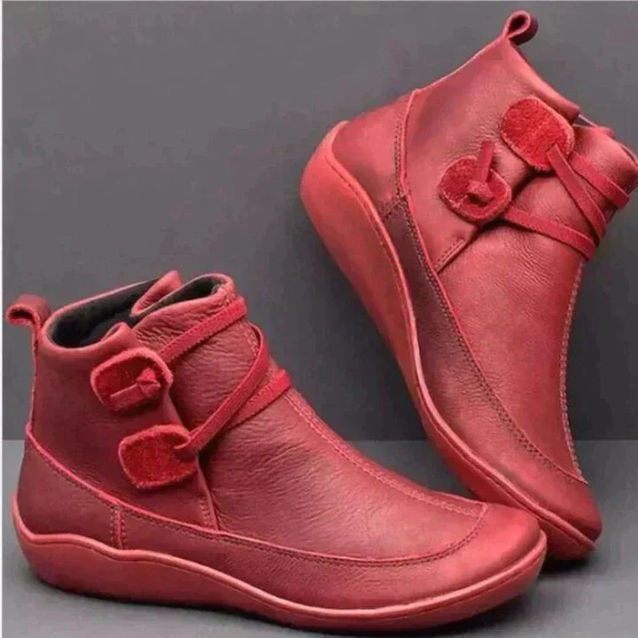 Black waterproof vegan leather ankle boots with cushioned interior, sleek silhouette for everyday wear