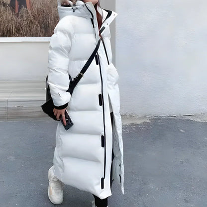 Women's long puffer jacket in black with hooded design and snap placket for sleek winter coverage