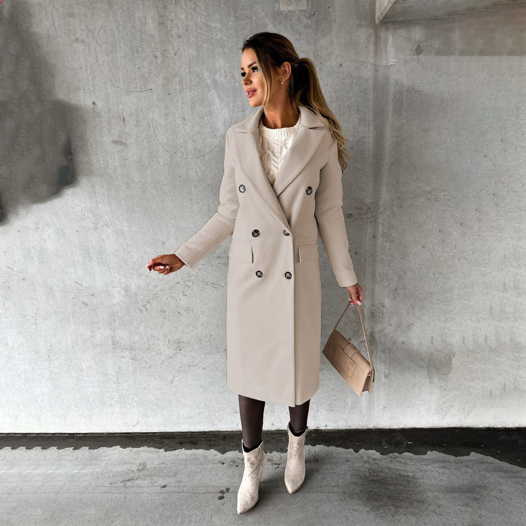 Women's long double-breasted wool blend coat elegant silhouette with flap pockets timeless tailored style